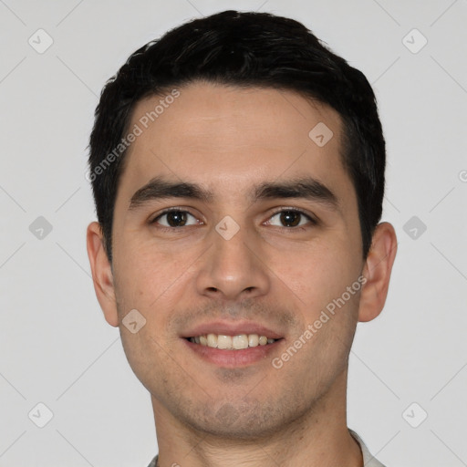 Joyful white young-adult male with short  black hair and brown eyes