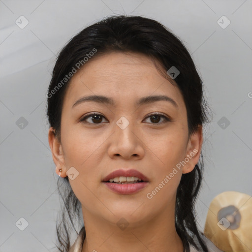 Joyful asian young-adult female with medium  brown hair and brown eyes