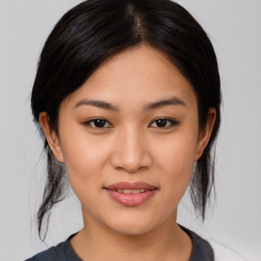 Joyful asian young-adult female with medium  brown hair and brown eyes