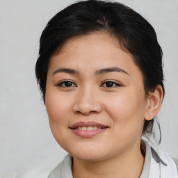 Joyful latino young-adult female with medium  brown hair and brown eyes