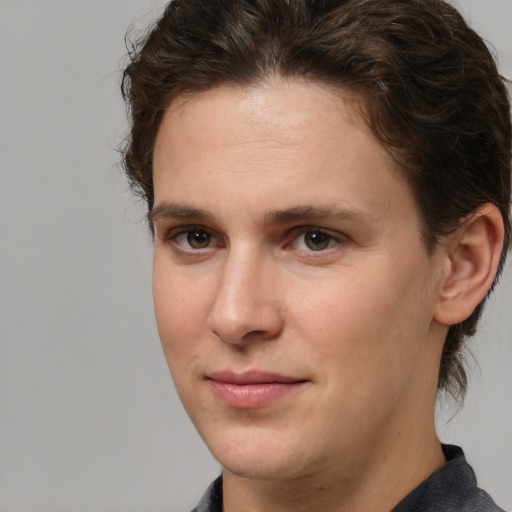 Joyful white young-adult male with medium  brown hair and brown eyes