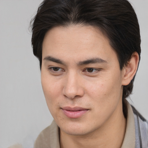 Joyful white young-adult male with medium  brown hair and brown eyes