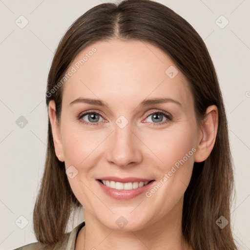 Joyful white young-adult female with long  brown hair and grey eyes