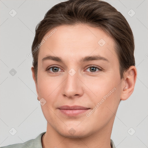 Joyful white young-adult female with short  brown hair and grey eyes