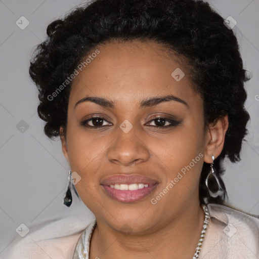 Joyful black young-adult female with long  black hair and brown eyes