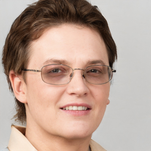 Joyful white adult female with short  brown hair and grey eyes