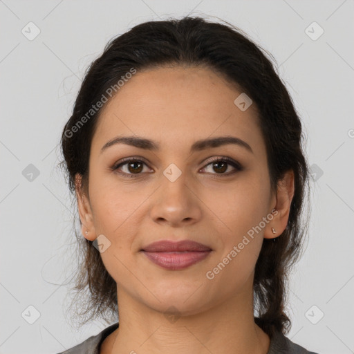 Joyful latino young-adult female with medium  brown hair and brown eyes