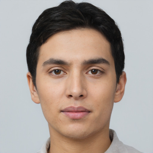 Neutral latino young-adult male with short  black hair and brown eyes