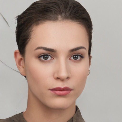 Neutral white young-adult female with short  brown hair and brown eyes