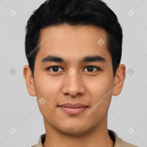 Joyful asian young-adult male with short  black hair and brown eyes