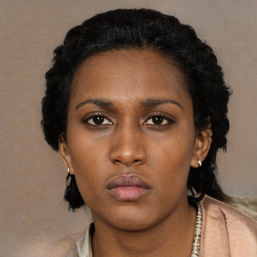 Neutral black young-adult female with short  black hair and brown eyes
