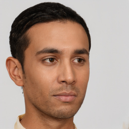 Neutral latino young-adult male with short  black hair and brown eyes