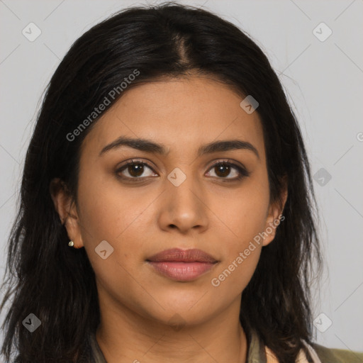 Joyful latino young-adult female with long  brown hair and brown eyes