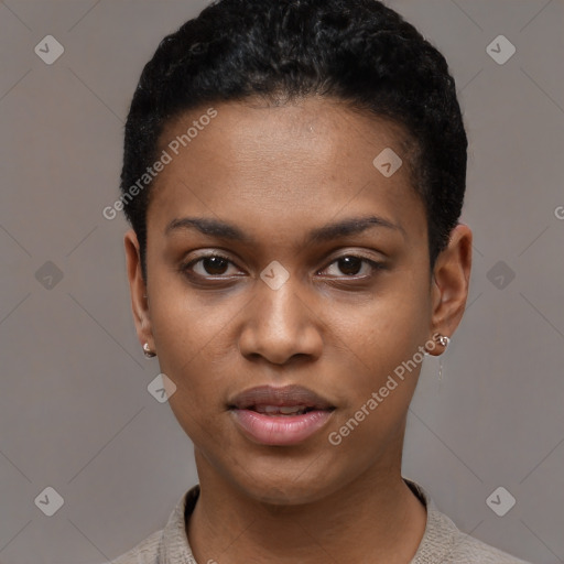 Joyful black young-adult female with short  black hair and brown eyes