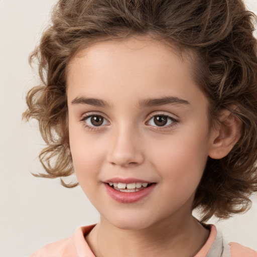 Joyful white child female with medium  brown hair and brown eyes