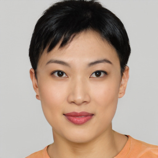 Joyful asian young-adult female with short  black hair and brown eyes