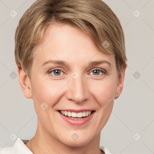 Joyful white young-adult female with short  brown hair and grey eyes