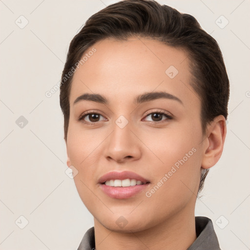 Joyful white young-adult female with short  brown hair and brown eyes