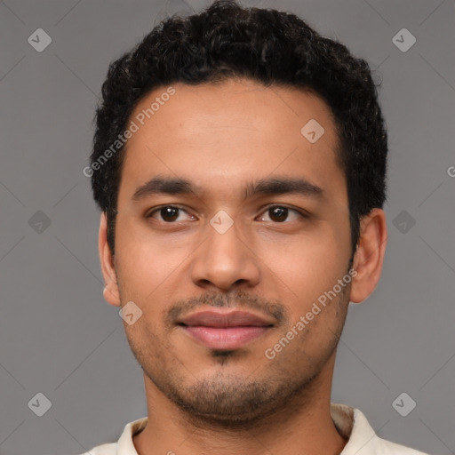 Joyful latino young-adult male with short  brown hair and brown eyes