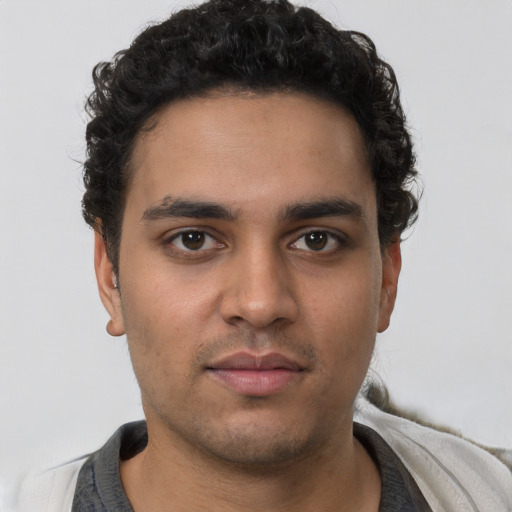 Neutral latino young-adult male with short  brown hair and brown eyes