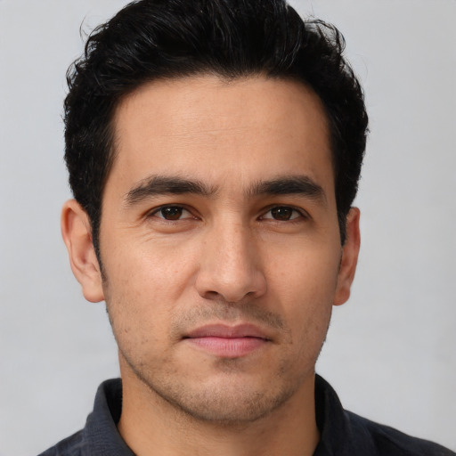 Neutral white young-adult male with short  black hair and brown eyes