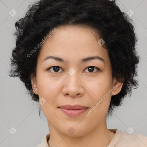 Joyful asian adult female with medium  brown hair and brown eyes