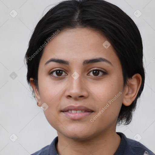 Joyful latino young-adult female with medium  black hair and brown eyes