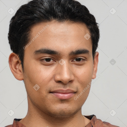 Joyful latino young-adult male with short  black hair and brown eyes