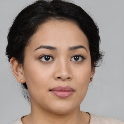 Joyful asian young-adult female with medium  brown hair and brown eyes