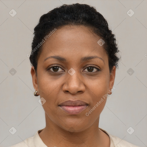 Joyful black young-adult female with short  brown hair and brown eyes