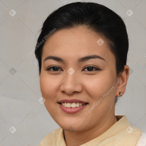 Joyful asian young-adult female with medium  brown hair and brown eyes