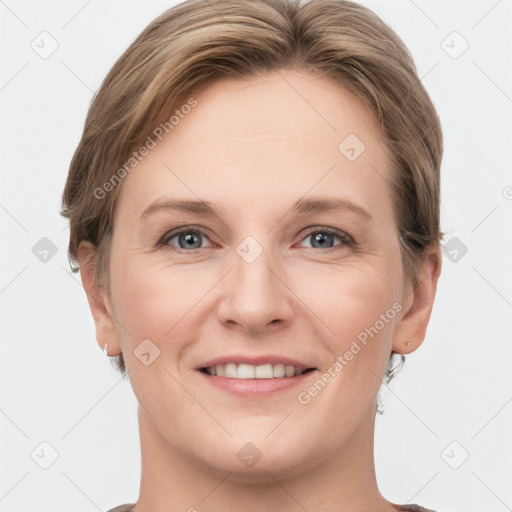 Joyful white young-adult female with short  brown hair and grey eyes