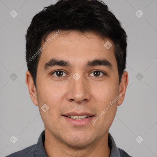 Joyful white young-adult male with short  black hair and brown eyes