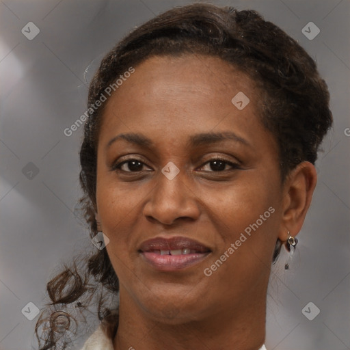 Joyful black adult female with medium  brown hair and brown eyes