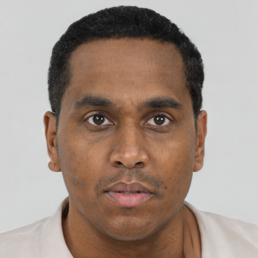 Neutral black adult male with short  black hair and brown eyes