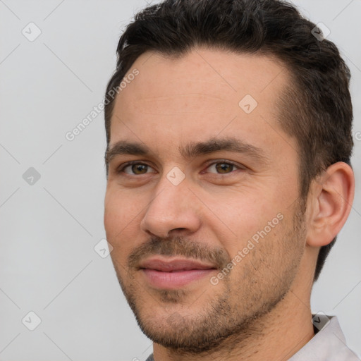 Joyful white young-adult male with short  brown hair and brown eyes