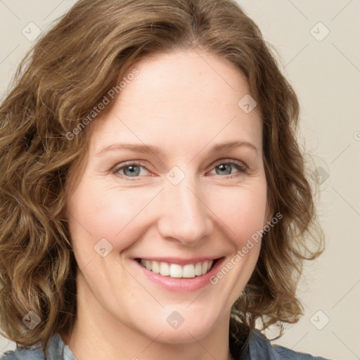 Joyful white young-adult female with medium  brown hair and green eyes