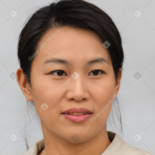 Joyful asian young-adult female with short  brown hair and brown eyes