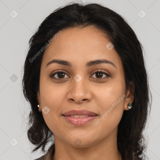 Joyful latino young-adult female with medium  brown hair and brown eyes