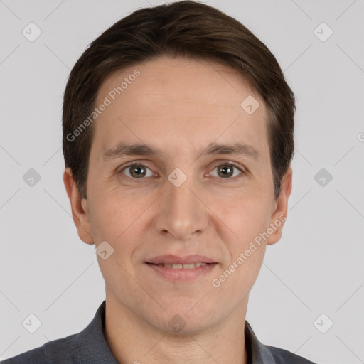 Joyful white adult male with short  brown hair and brown eyes