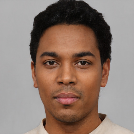 Neutral latino young-adult male with short  black hair and brown eyes
