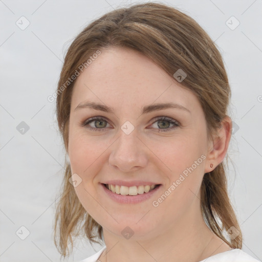 Joyful white young-adult female with medium  brown hair and grey eyes