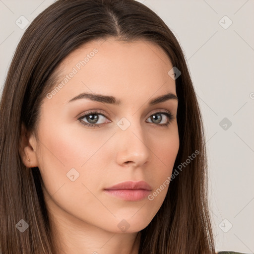 Neutral white young-adult female with long  brown hair and brown eyes