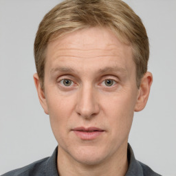 Joyful white adult male with short  brown hair and grey eyes