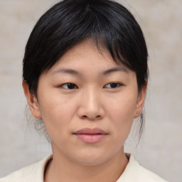 Neutral asian young-adult female with medium  brown hair and brown eyes