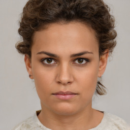 Neutral white young-adult female with short  brown hair and brown eyes