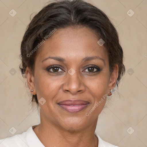 Joyful black adult female with short  brown hair and brown eyes