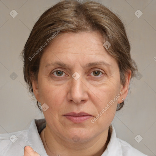 Joyful white middle-aged female with medium  brown hair and brown eyes