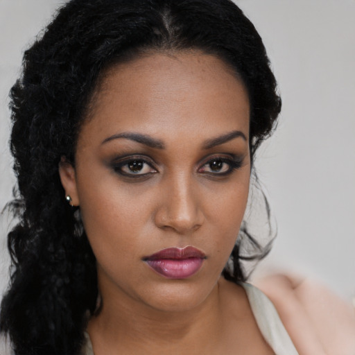 Neutral black young-adult female with long  black hair and brown eyes