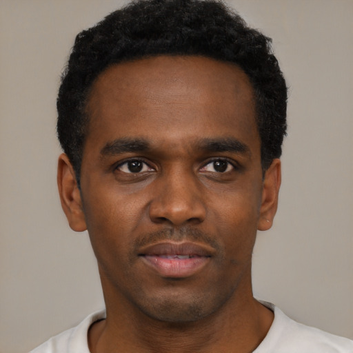 Neutral black young-adult male with short  black hair and brown eyes